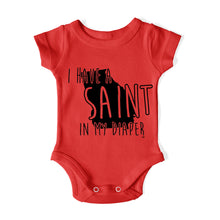 Load image into Gallery viewer, I HAVE A SAINT IN MY DIAPER Baby One Piece